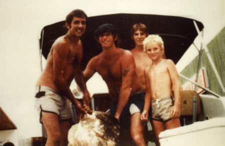 Roger Gunter with hat and goliath grouper.