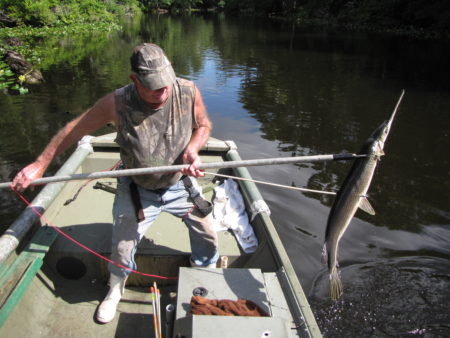 Roger Gunter with garfish shot with bow and arrow.